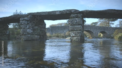 Beautiful low level shot of an ancient clapper bridge on Dartmoor, England photo