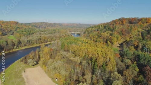 River and Forest in Autumn Sigulda city nature, Gauya, 4K drone flight, bridge car drive from above photo