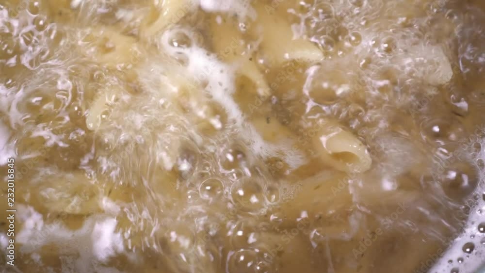 Boiling pasta in pan, cooking macaroni Boiling pasta in pan, cooking macaroni