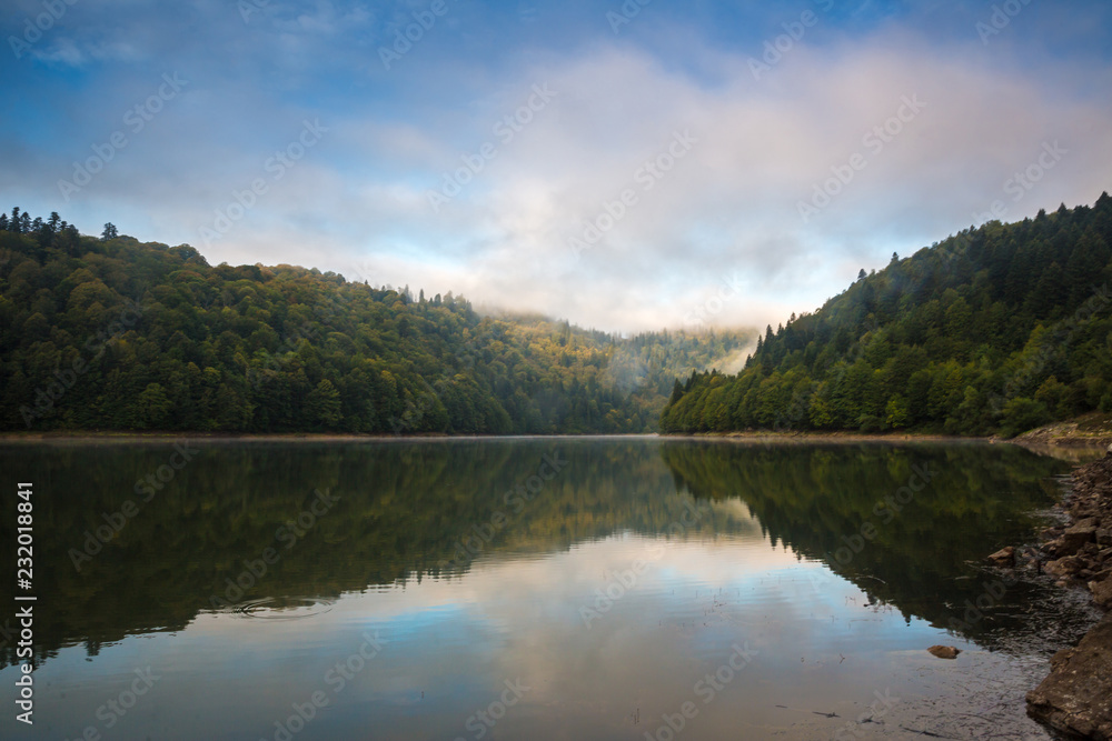 Morning view on foggy Shaori Lake at sunrise Georgia country Morning view on foggy Shaori Lake at sunrise Georgia country