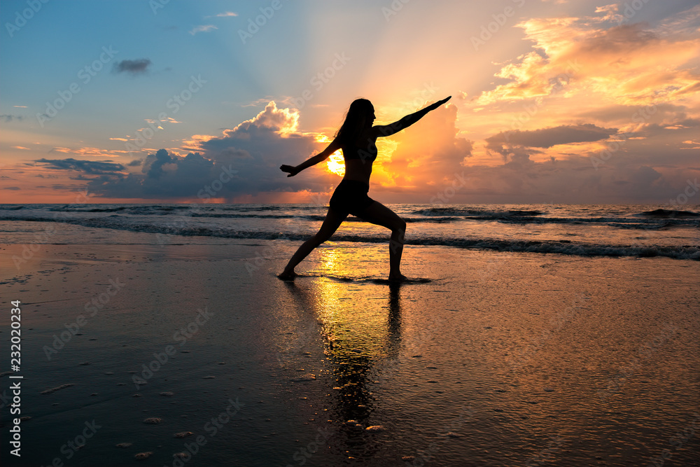 Yoga at sunrise on the beach at St Simons Island, GA