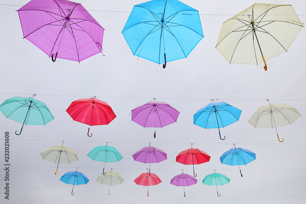 Colourful umbrella in sky 