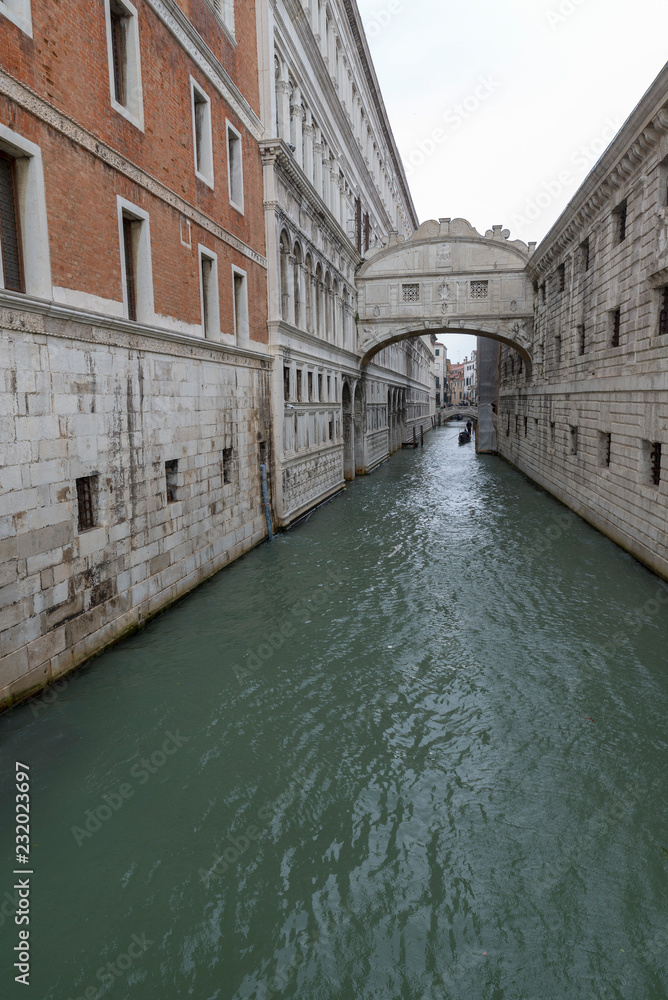 VENICE, ITALY- OCTOBER 30, 2018: The Bridge of Sighs. The enclosed bridge passes over the Rio di Palazzo, and connects the New Prison  to the interrogation rooms in the Doge's Palace.
