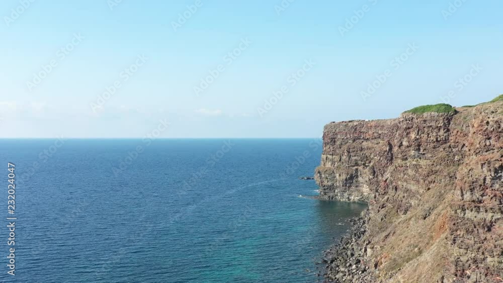 Aerial view of the rocky coastline in the village of Bosa located in the north-west of Sardinia, Italy. Aerial view of the rocky coastline in the village of Bosa located in the north-west of Sardinia, Italy.