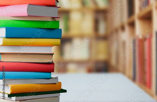 Old stacked books on wooden table