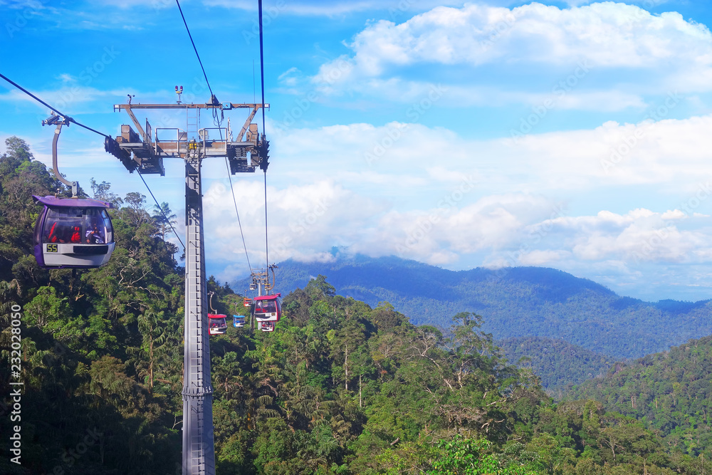 GENTING HIGHLANDS, MALAYSIA - DECEMBER 21 : Tourists travel on cable car of Genting Skyway. It is a gondola lift connecting Gohtong Jaya and Genting Highland.