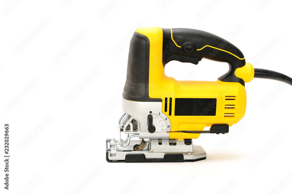 Isolated left side electric jig saw on a white background