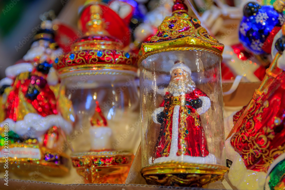 Fototapeta premium Colorful Christmas ornaments of Santa Claus on display for sale in a store