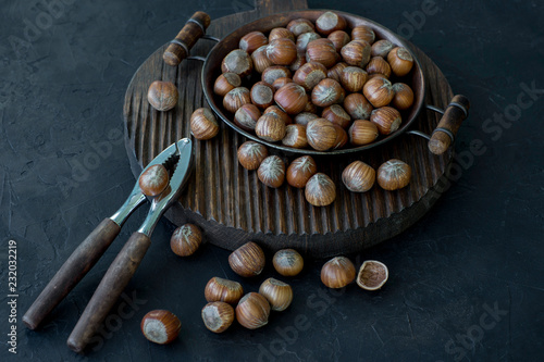 on a wooden stand hazelnuts and nutcraker 