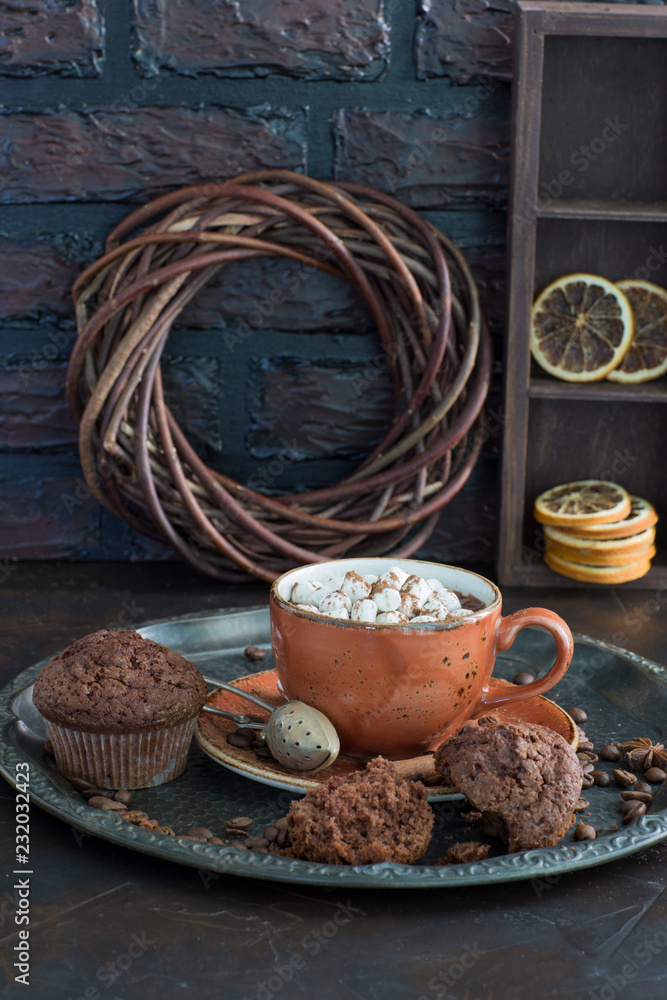 Hot chocolate with marshmallows and muffins on the table Hot chocolate with marshmallows and muffins on the table