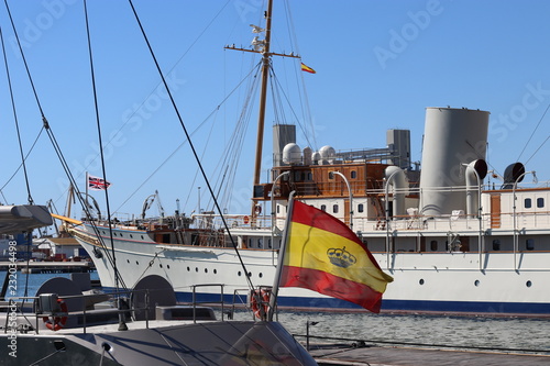 TERRAGONA, SPAIN - OCTOBER 05, 2018: Spanish flag waving on the yacht in the port of Tarragona. photo