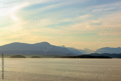 Sunset view of the shoreline of north Vancouver from the ocean, BC, Canada