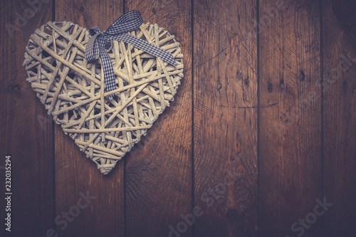 Heart shape on wooden table. symbol of love