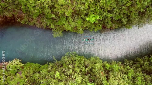 Aerial view of traditional fishing boat sailing in Bojo River, Aloguinsan, Philippines. photo