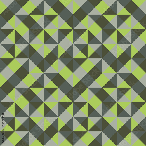 Abstract seamless pattern of triangles. Pleasant combination of green shades.