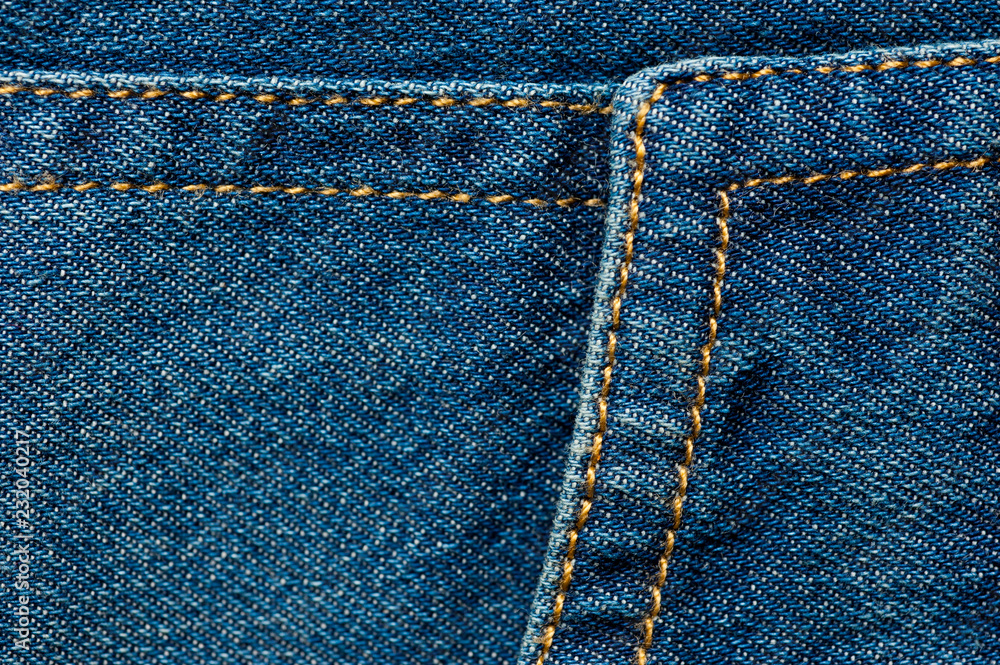 Textured blue denim texture stitched with a button-up texture Textured blue denim texture stitched with a button-up texture