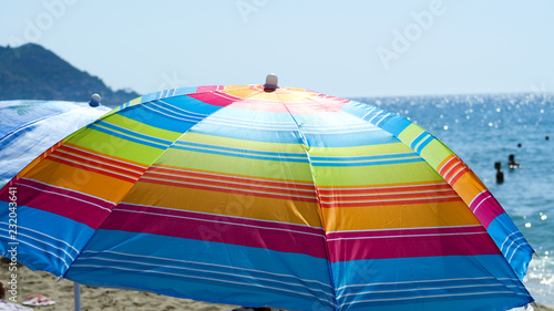 Bright and colourful beach umbrella