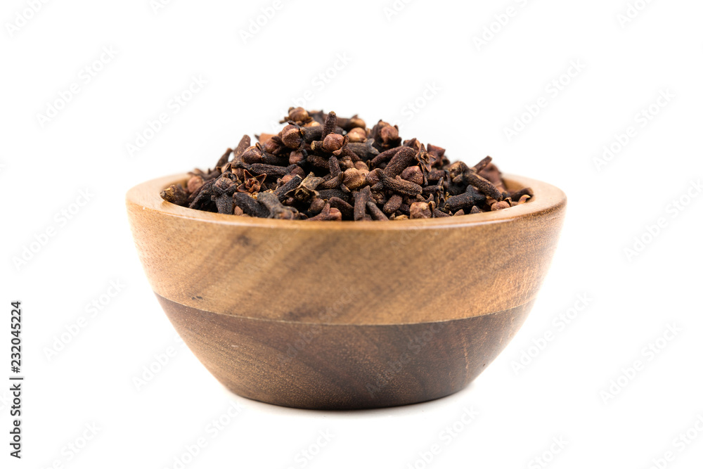 Whole clove heads and pieces isolated over white Whole clove heads and pieces isolated over white