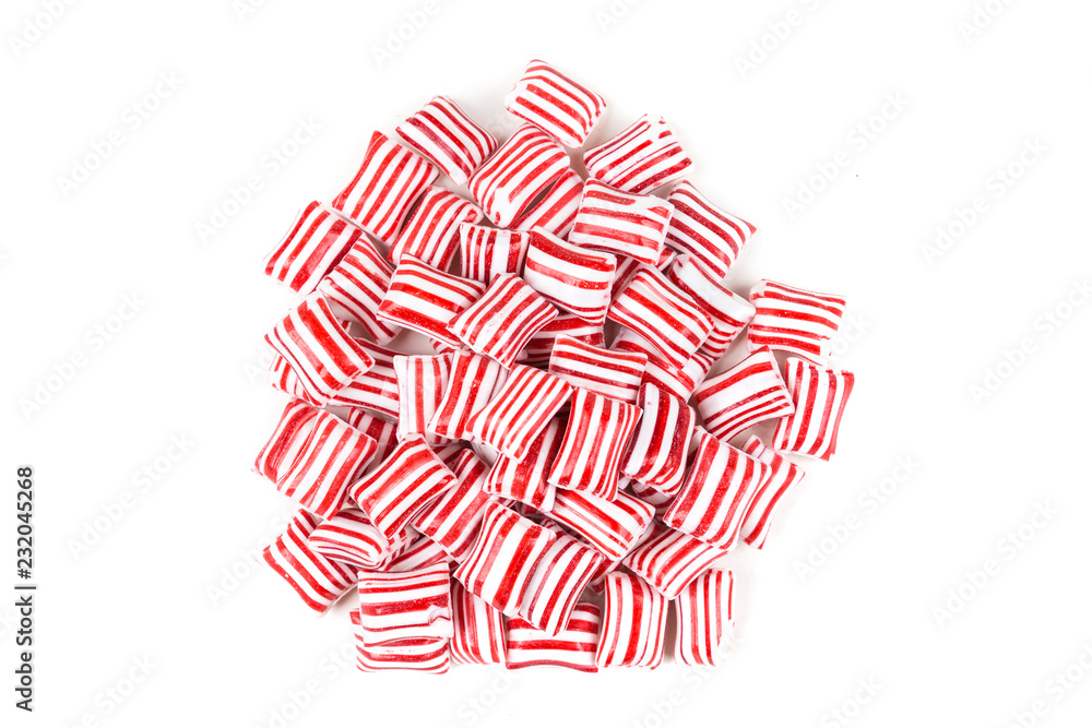 Red and white striped holiday candy isolated over white Red and white striped holiday candy isolated over white
