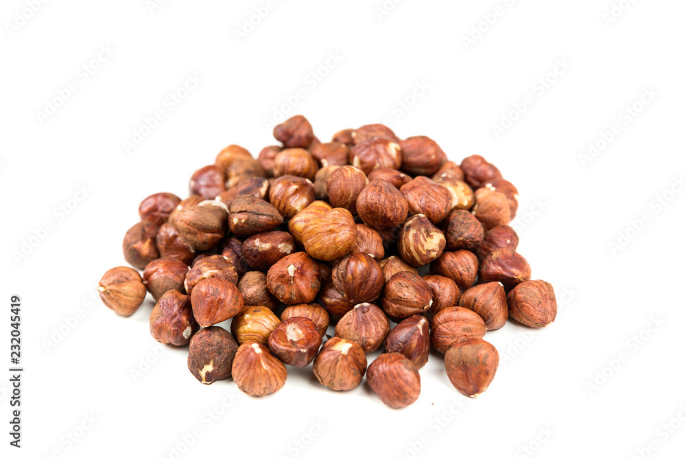 Pile of whole unshelled hazelnuts isolated Pile of whole unshelled hazelnuts isolated