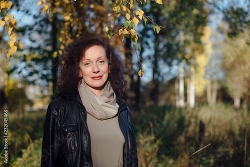 Wallpaper Mural beautiful woman 50 years in autumn forest Torontodigital.ca