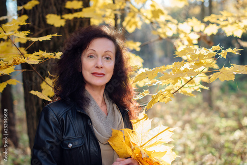 Wallpaper Mural beautiful woman 50 years in autumn forest Torontodigital.ca