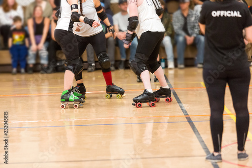 Roller derby players compete against each other