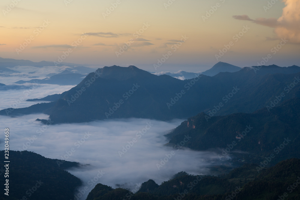 Sunrise and Mist mountain in Phu Chi Dao located in Chiang Rai, Thailand. Phu Chi Dao is the natural border between Thailand and Laos.