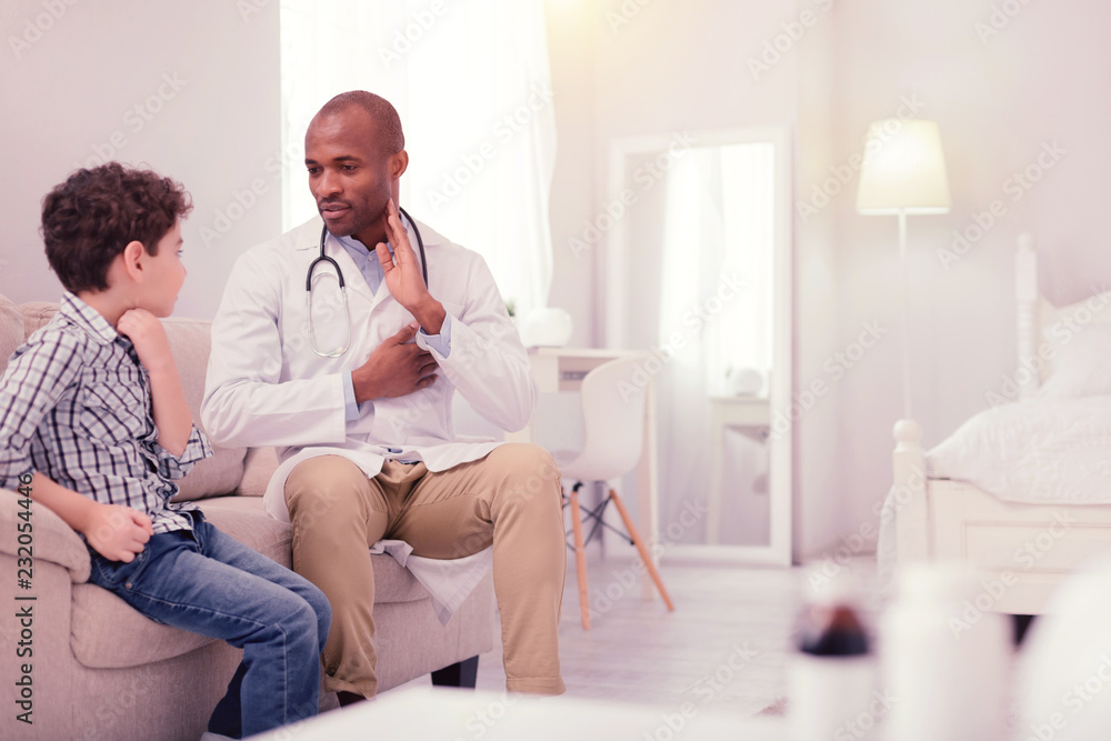 Obraz premium Joyful nice man talking to his son