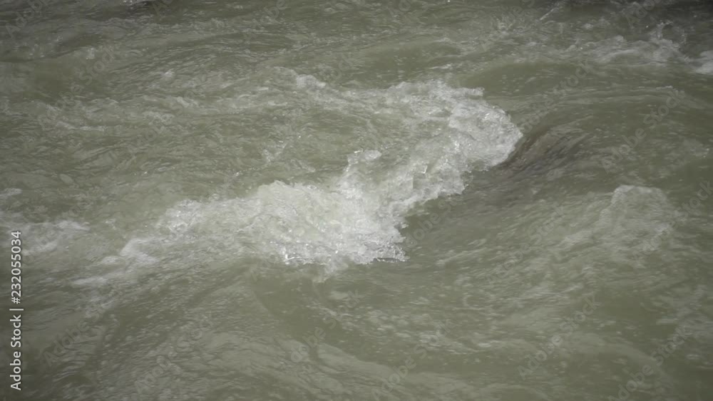 Water from the river on a rock in slow motion Water from the river on a rock in slow motion