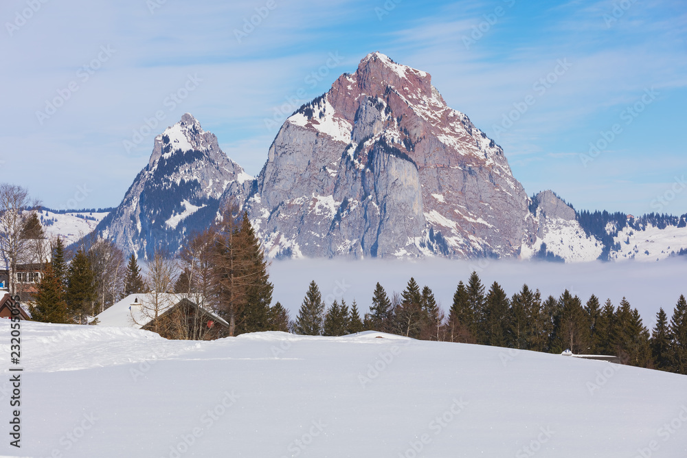 View from the village of Stoos in the Swiss canton of Schwyz in winter, Kleiner Mythen and Grosser Mythen summits in the background