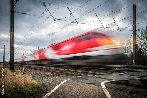 A Speeding Red Train Passes In A Very Dramatic Scene