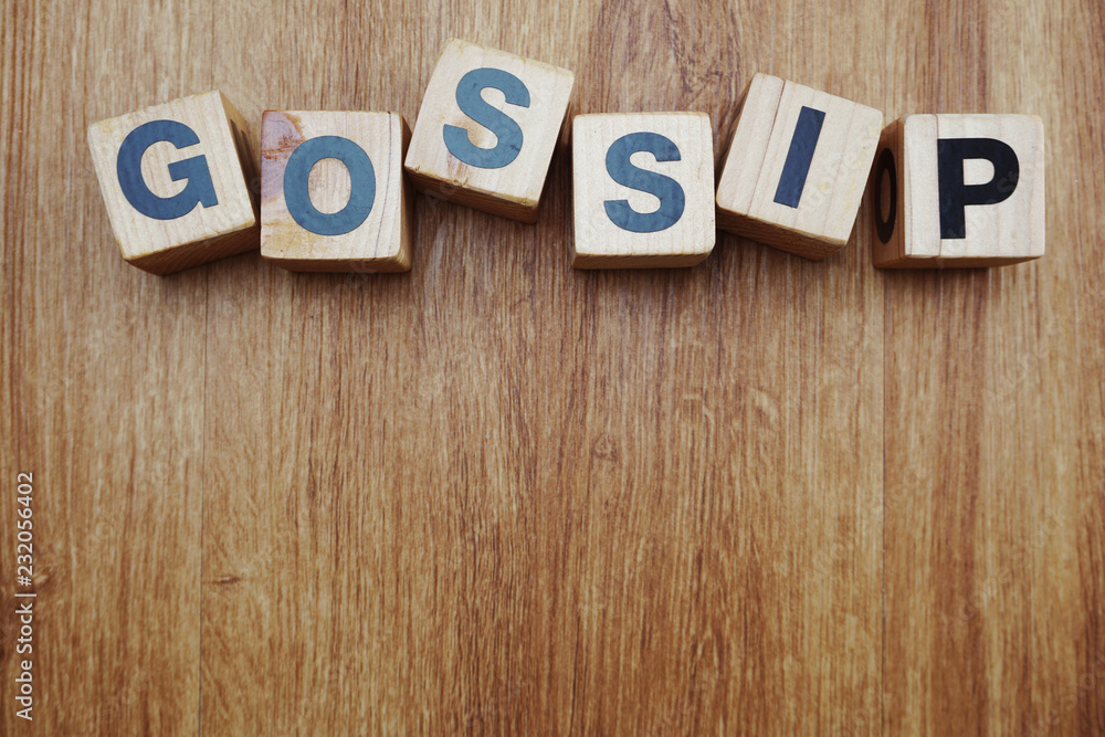 gossip word alphabet letter on wooden background gossip word alphabet letter on wooden background