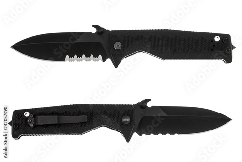 black military folding knife with serrated blade isolated on white