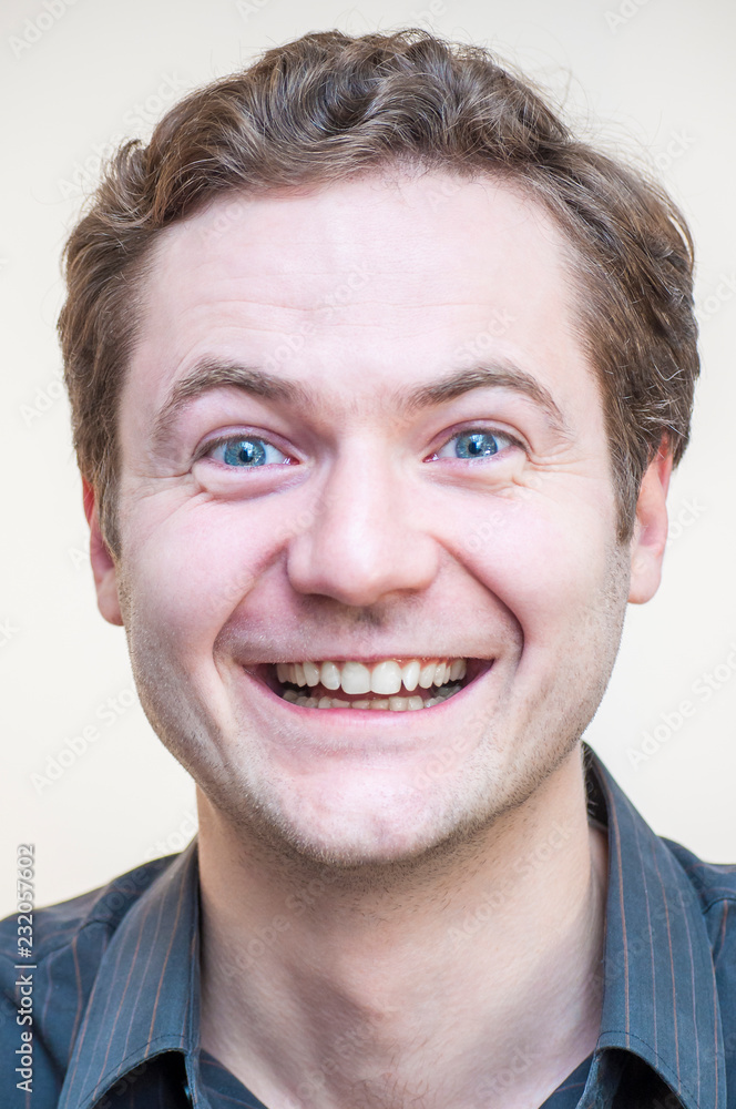 Fototapeta premium Smiling blue-eyed man portrait