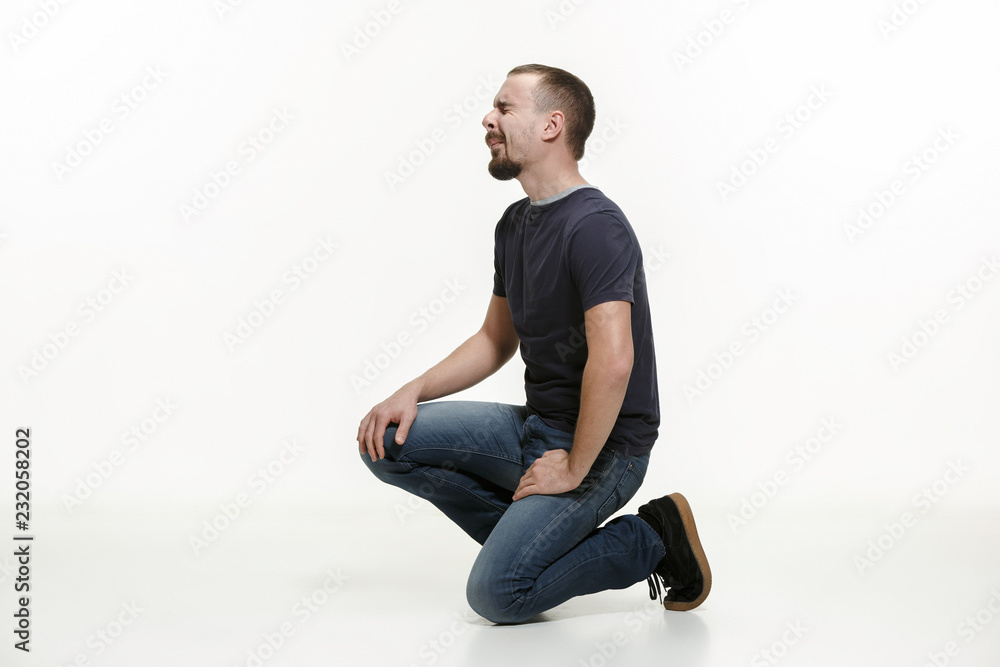very disappointed man isolated on white studio background very disappointed man isolated on white studio background