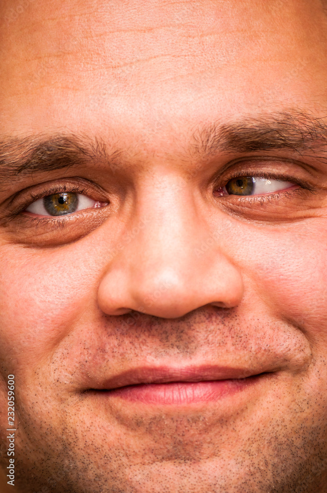 Funny, positive, squinting man. Facial expression, emoji face, emotion close-up. Funny, positive, squinting man. Facial expression, emoji face, emotion close-up.