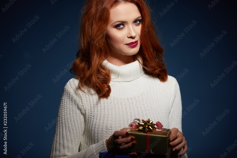 Portrait of a happy smiling girl opening a gift box Portrait of a happy smiling girl opening a gift box
