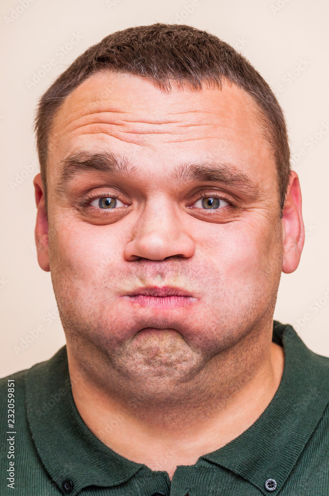 Obraz premium Man pouting mouth.