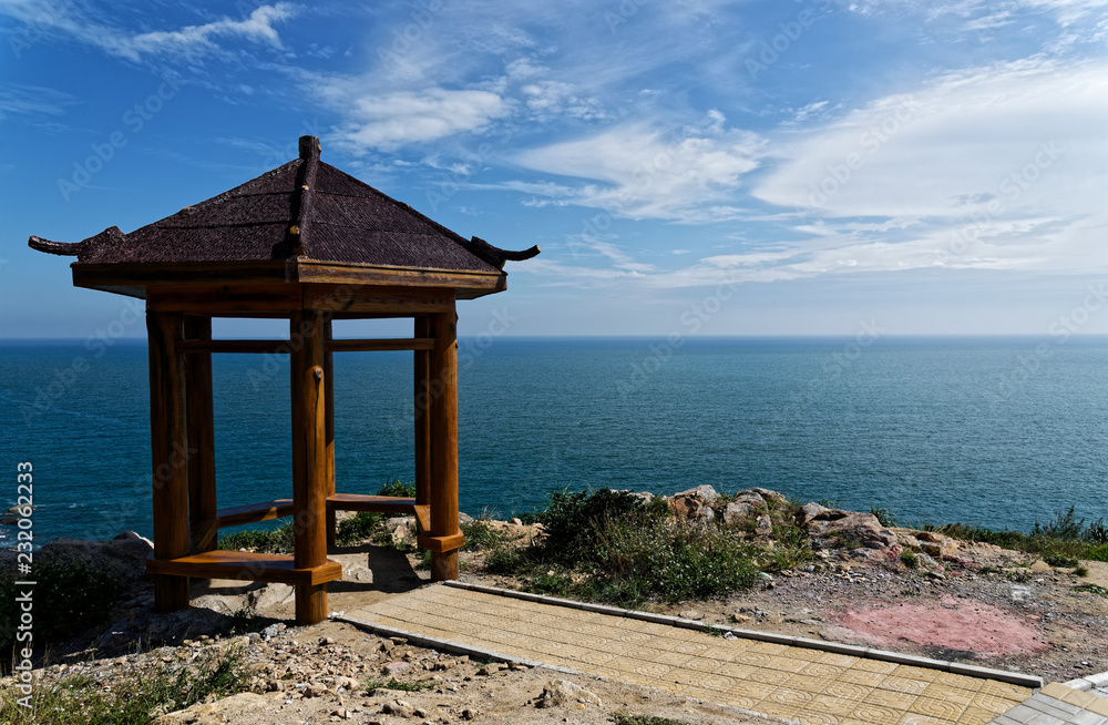 Pagoda pavilion, seashore and blue sky