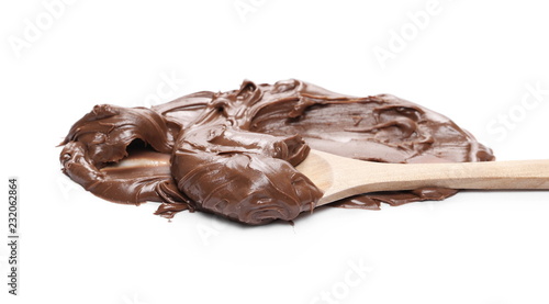 Chocolate cream with wooden spoon isolated on white background