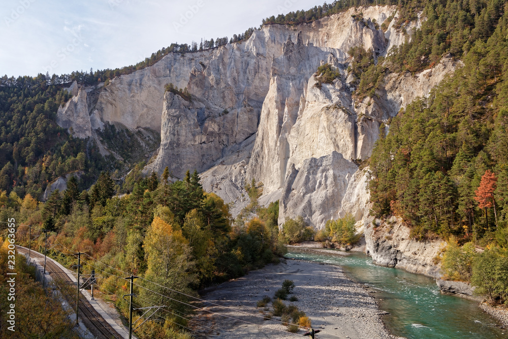 View of cliffs from sunny autumnal Ruinaulta - Rheinschlucht (Rhine canyon) near Versam-Safien, Switzerland