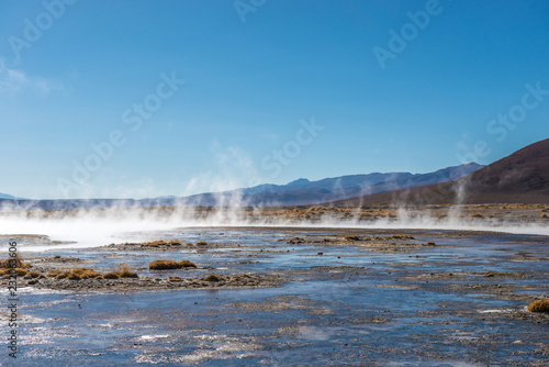 Sunshine surface covered with steam and geysers in Bolivia