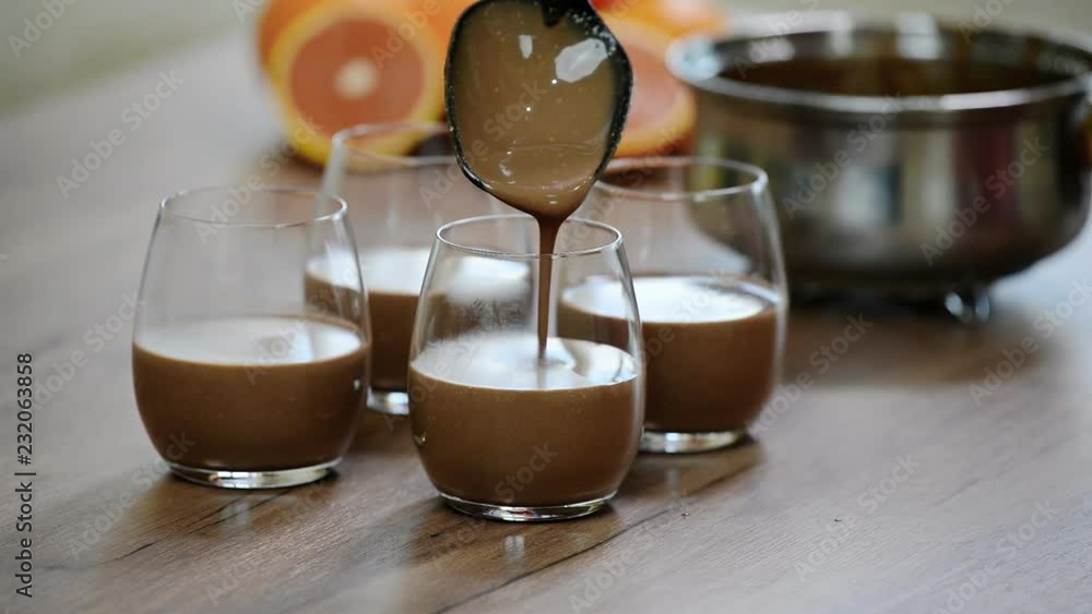 Making chocolate Panna cotta in a glass beaker. Making chocolate Panna cotta in a glass beaker.