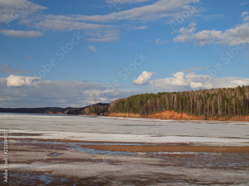Spring river, the ice is melting. Russian spring nature. Russia, Ural, Perm Region