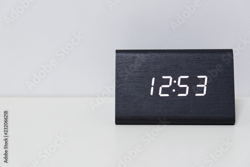 Black digital clock on a white background showing time 12:53 photo