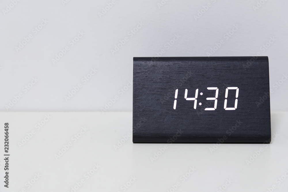 Black digital clock on a white background showing time 14:30 Stock-Foto |  Adobe Stock