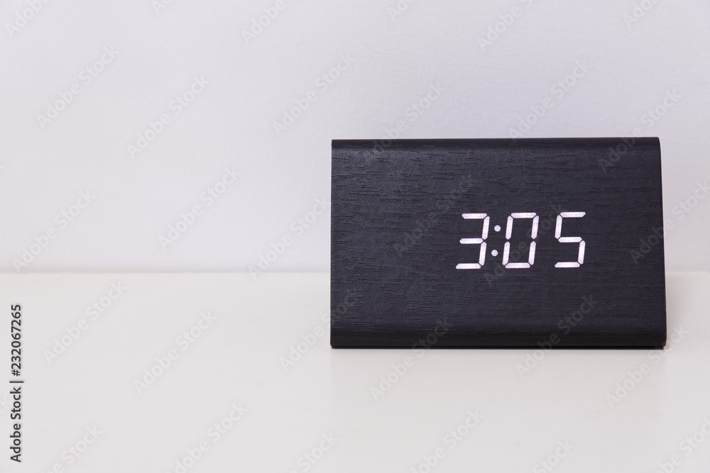 Black digital clock on a white background showing time 3:05 Stock Photo |  Adobe Stock