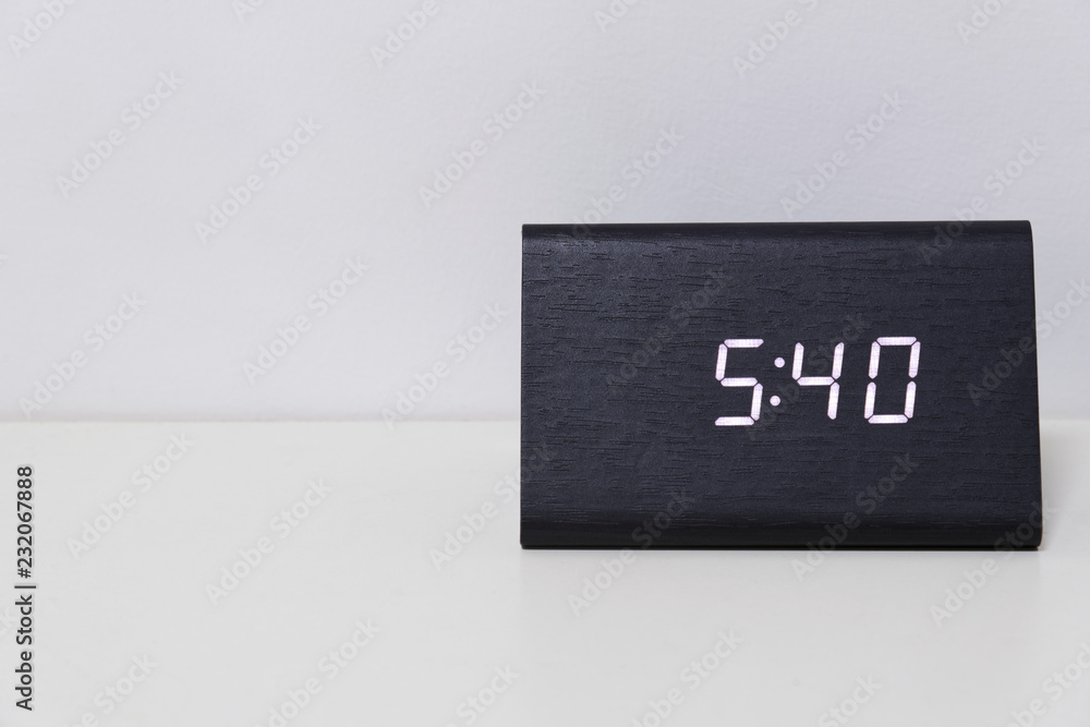 Black digital clock on a white background showing time 5:40 Stock-Foto |  Adobe Stock