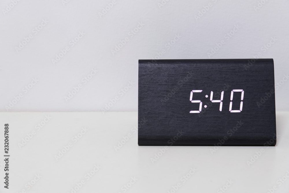 Black digital clock on a white background showing time 5:40 Stock Photo